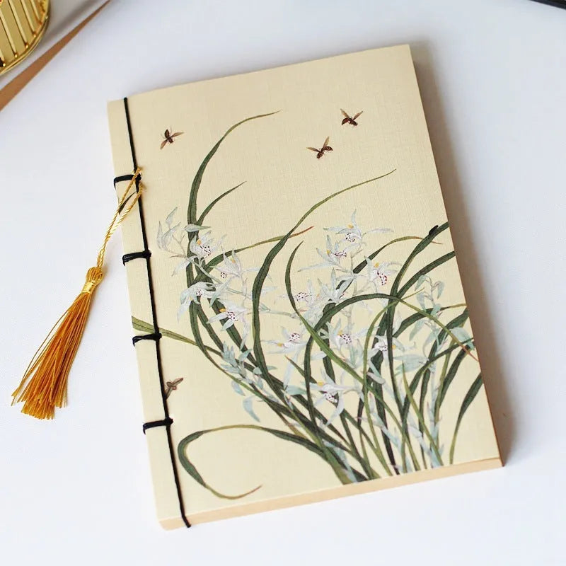 Antique wire-bound notebook with embossed cowhide cover and black wax rope binding
