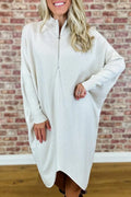 Women's solid colour knitted loose dress with front zip and raglan sleeves.