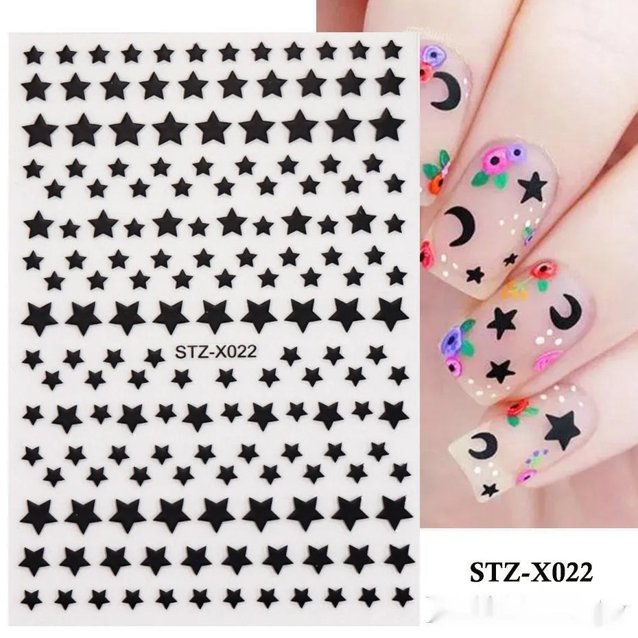 Set of 60 black and silver cartoon pattern nail strip stickers with plastic application patch.