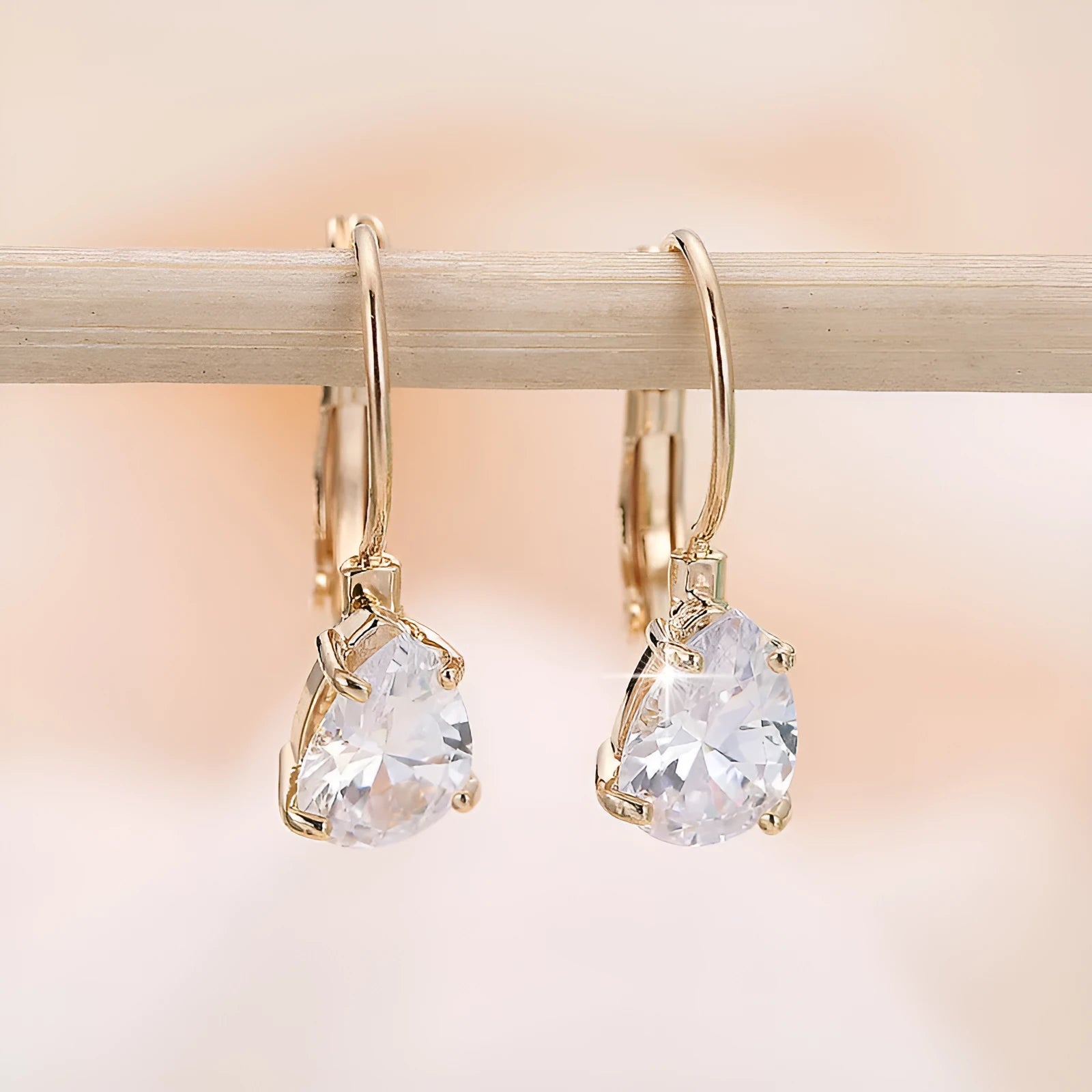 Copper drop-shaped fashion earrings with platinum plating and inlaid gem details.
