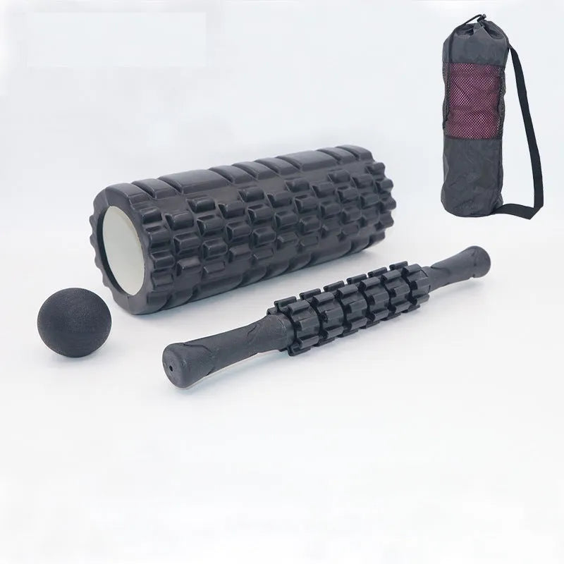Black foam roller massage stick with gear design, 33cm long, on a plain background.