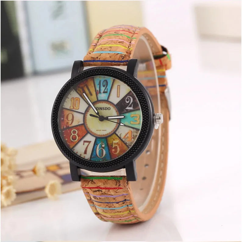 Women's vintage-style quartz watch with brown leather strap and silver round 37mm dial.