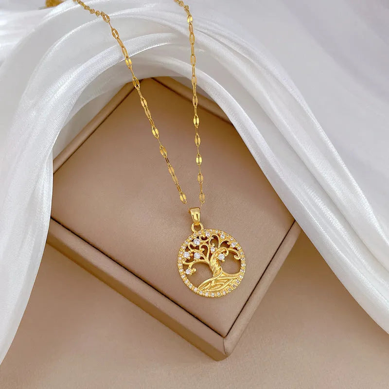Gold-plated women's necklace with detailed lucky tree pendant featuring zircon stones and mother of pearl shell