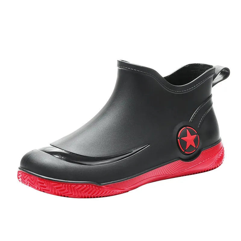 Unisex low-cut PVC rain boots in black with round toe and moulded plastic sole