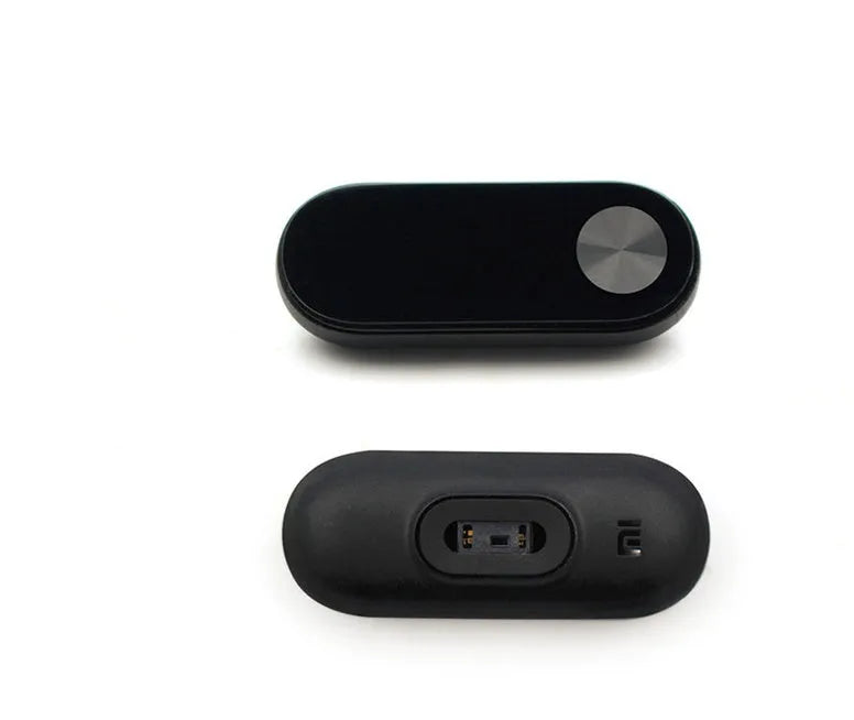 Xiaomi Mi Band 2 black fitness tracker on wrist showing OLED screen with heart rate data
