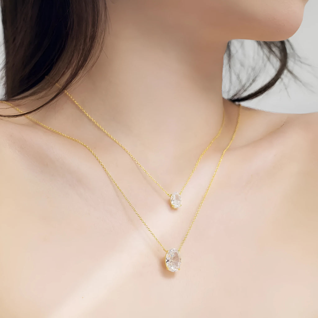 Women's sterling silver necklace with a small geometric oval ice flower pendant.