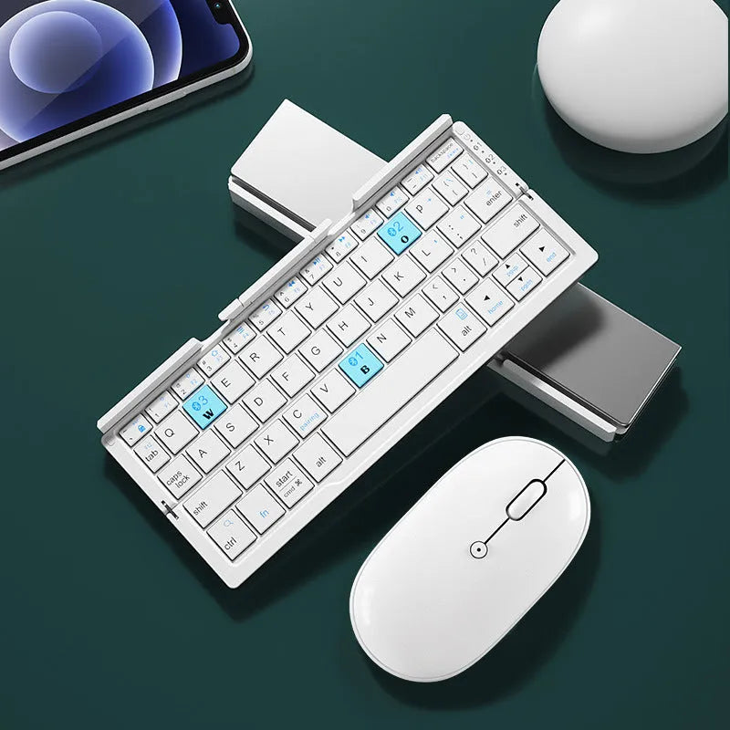 Silver white folding Bluetooth keyboard opened with stand supporting tablet