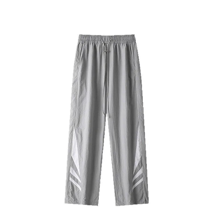 Men's grey straight-leg casual trousers with a loose plus-size fit and button fly.