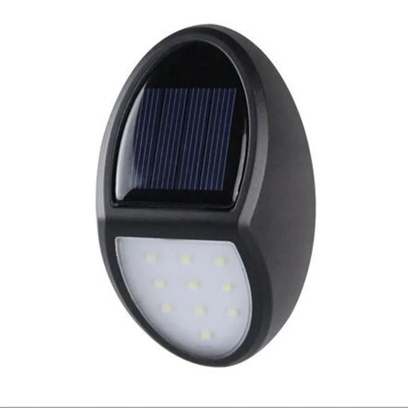 Black solar-powered LED wall light with automatic light sensor for outdoor garden use