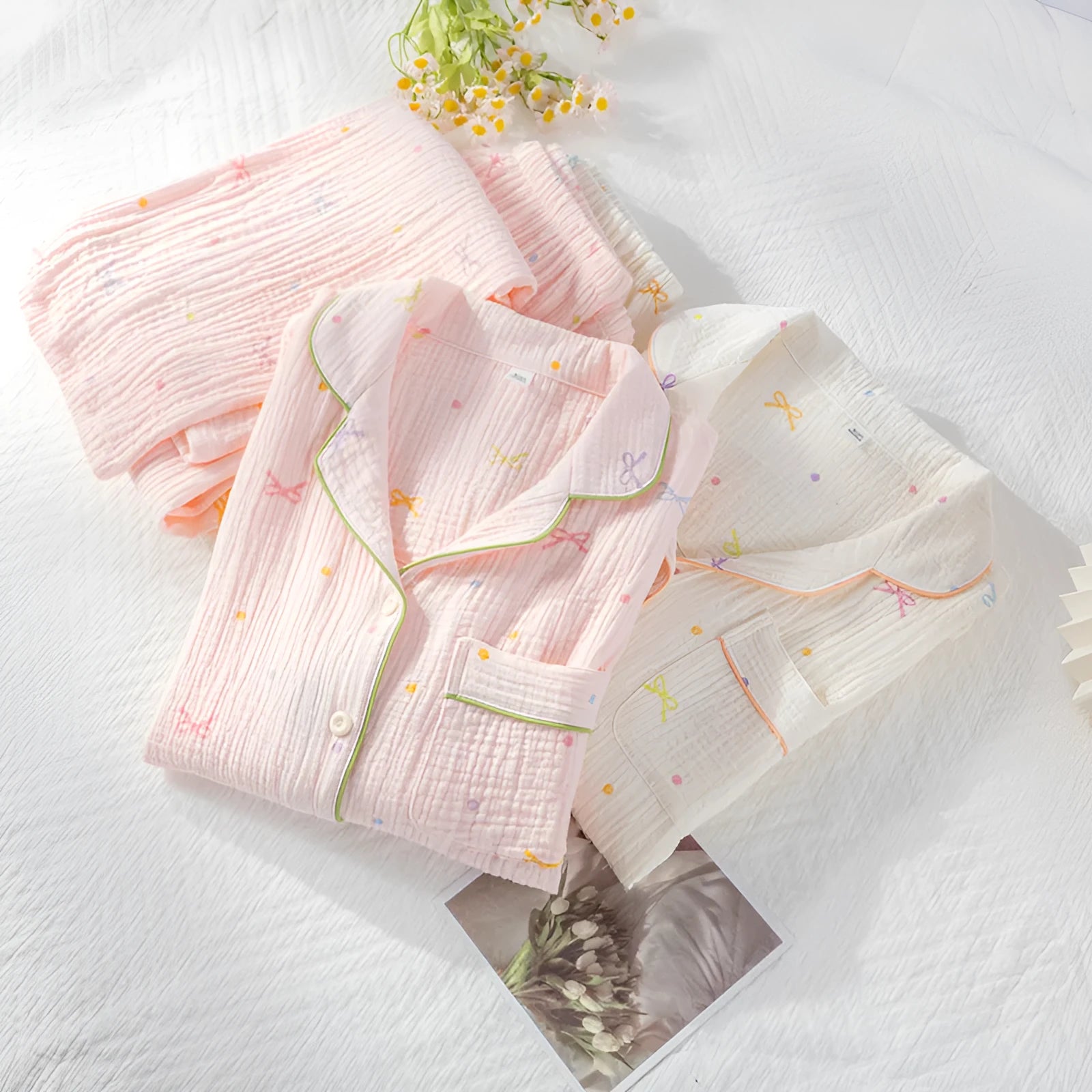 Women's cotton pajamas set in pink with long sleeves and trousers on hanger