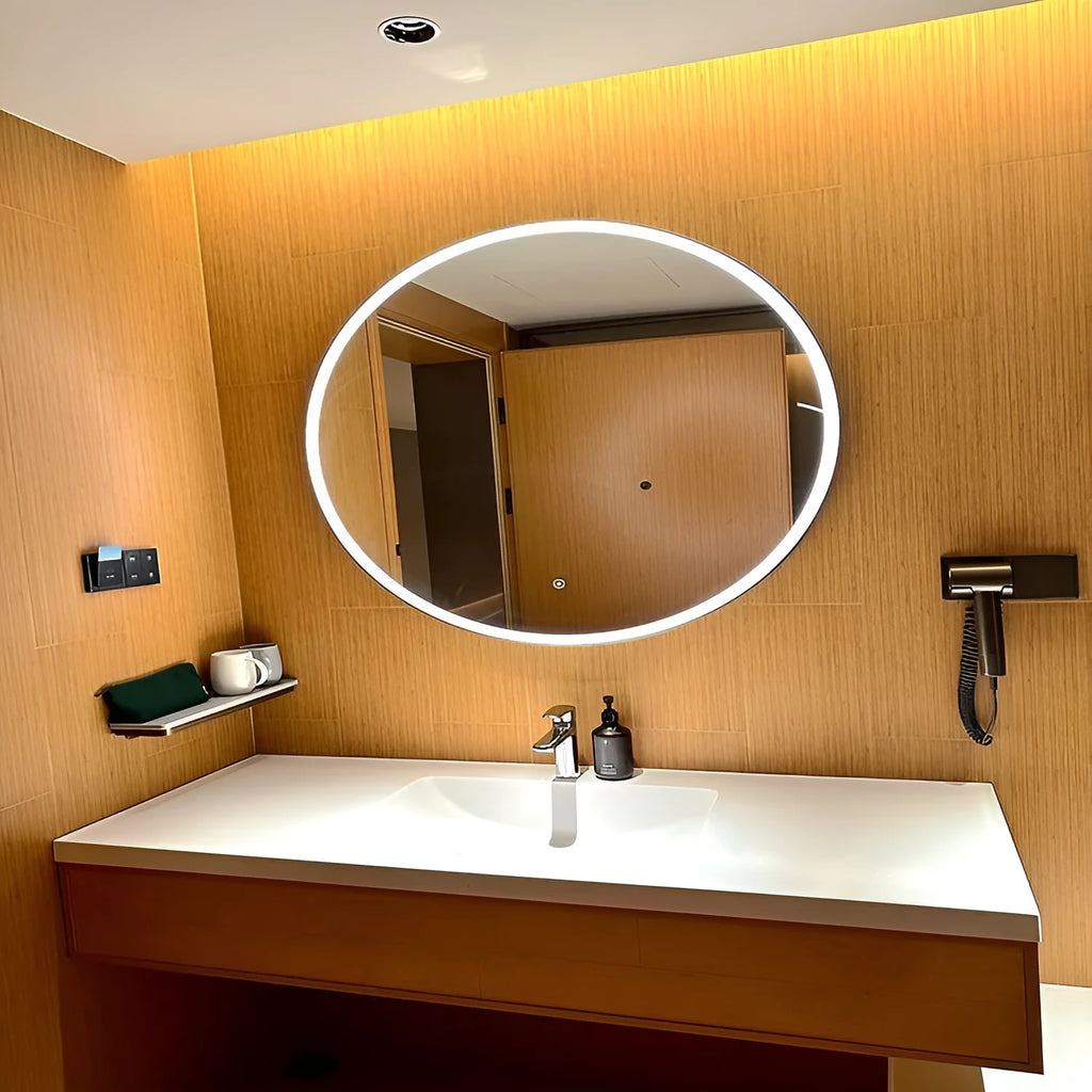 Round black aluminium frame LED smart bathroom mirror on wall with touch control for light colour and dimming.