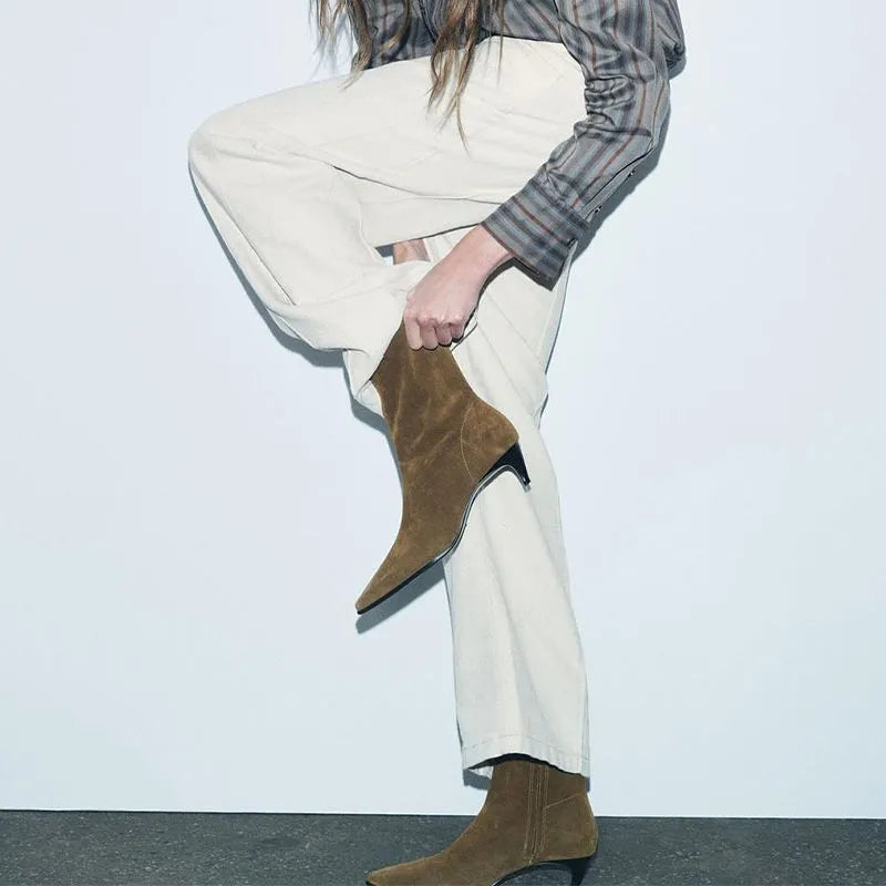 Brown women's retro ankle boots with a square toe, side zip, and a mid-height stiletto heel on a white background.
