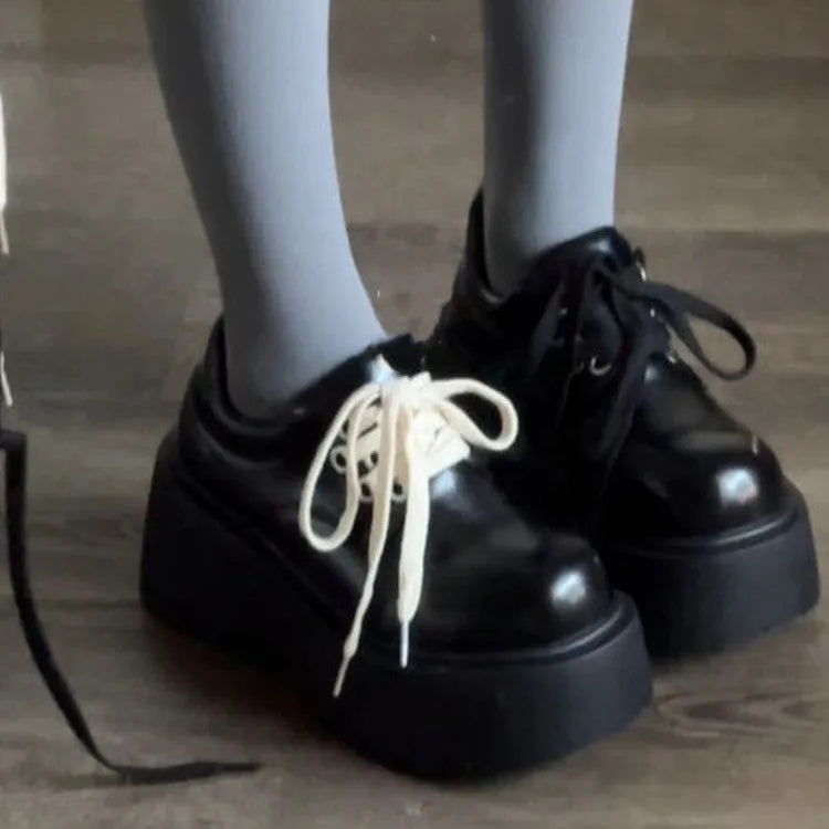 Matte black women's lace-up platform heels with chunky 6-8cm sole and round toe.