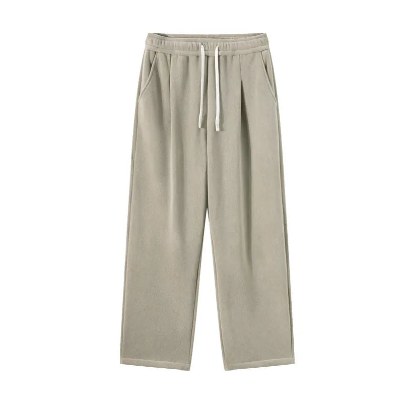 Men's apricot coloured loose-fit polar fleece trousers with a thick lining and drawstring waist.