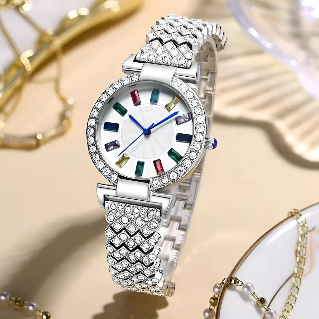 Gold quartz bracelet watch with round dial and alloy band on white background