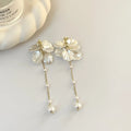 Women's acrylic shell pearl tassel earrings showing four clip types and 8.8cm length
