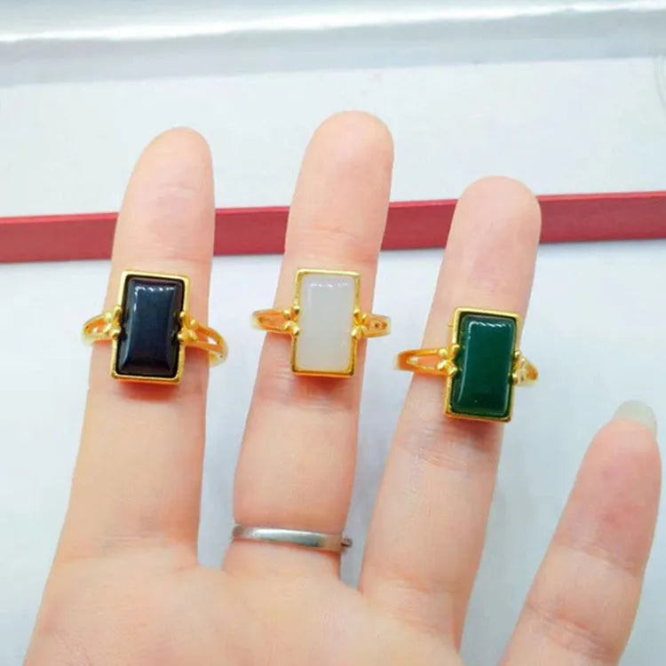 Adjustable brass gold-plated ring with gemstone inlays in black, green, or white colour options