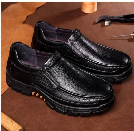 Men's black and brown business casual slip-on shoes made of cowhide leather with a rubber sole.