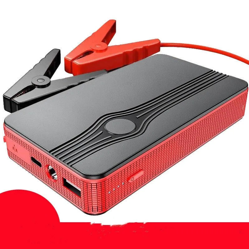Red K4-E portable car jump starter power bank with USB port and display, shown next to included data cable.