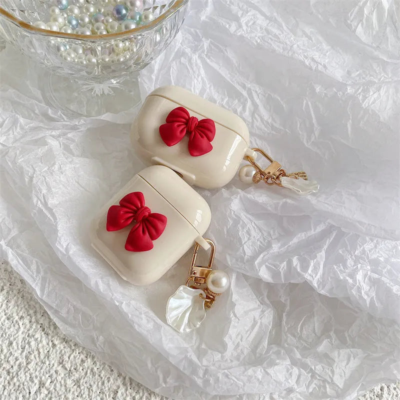 Beige red bow shell clamshell TPU protective cover for AirPods Pro wireless earphone case.