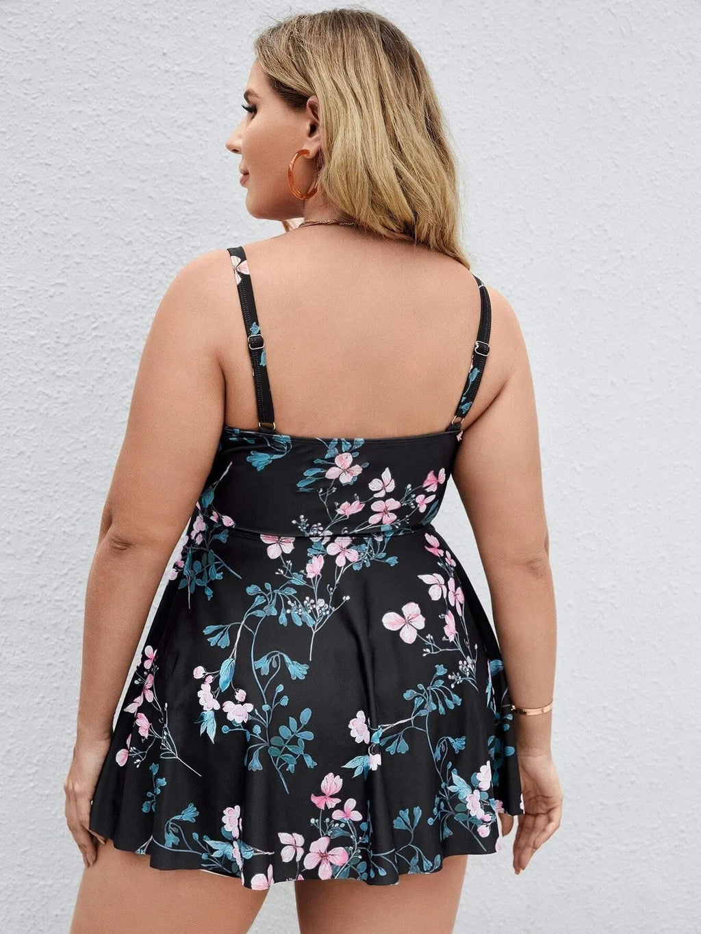 Women's floral print one-piece swimsuit with split colour design on mannequin
