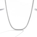 Women's sterling silver necklace with round diamond-cut pendant on silver chain