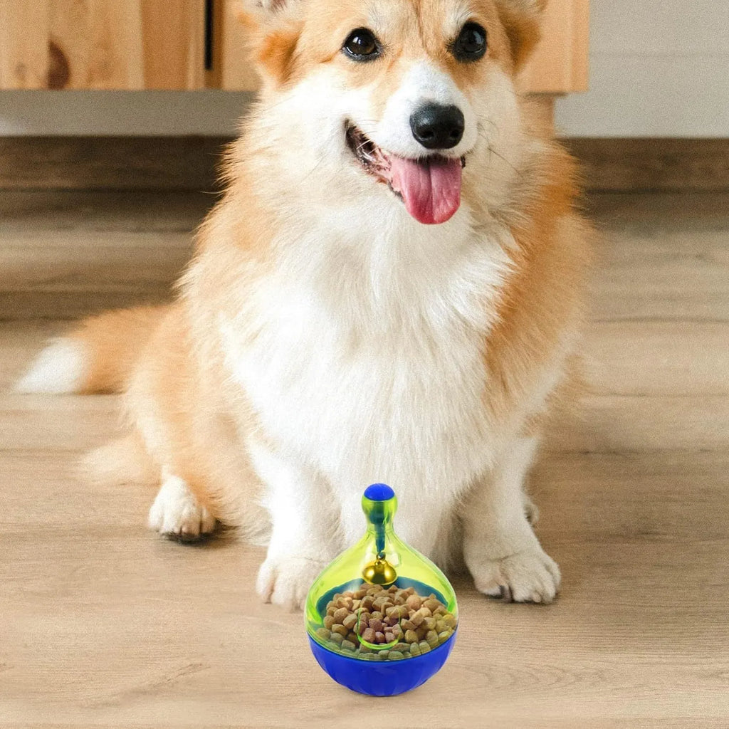 Light grey interactive pet treat dispenser ball with tumbler shape on a wooden floor.