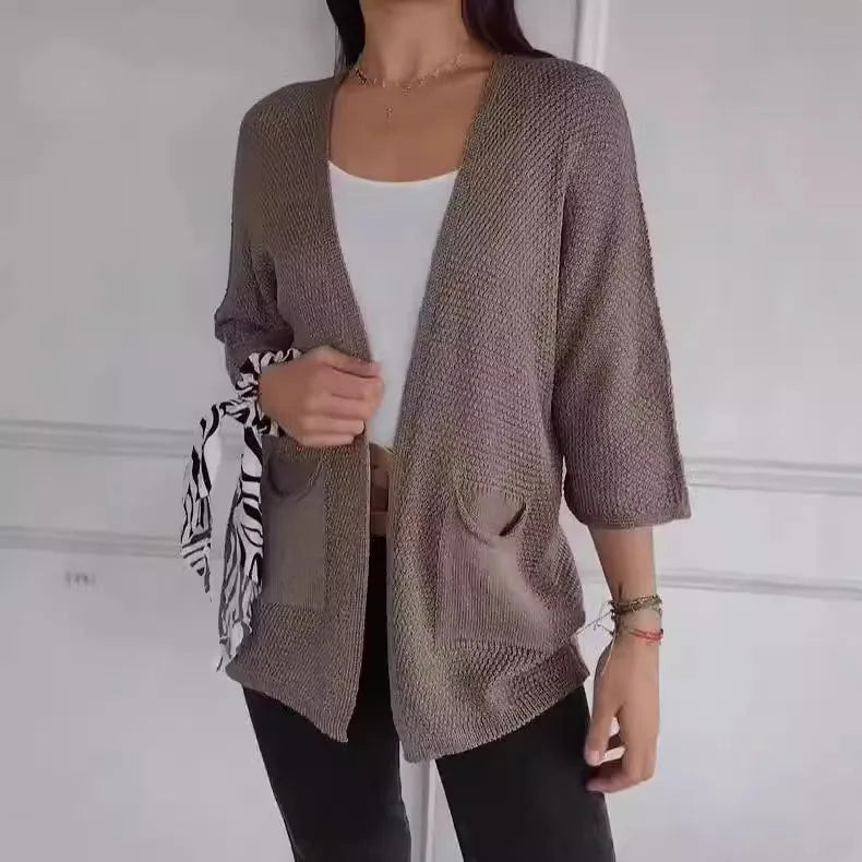 Women's waffle knit cardigan coat with nine-quarter sleeves in army green colour showing pocket detail