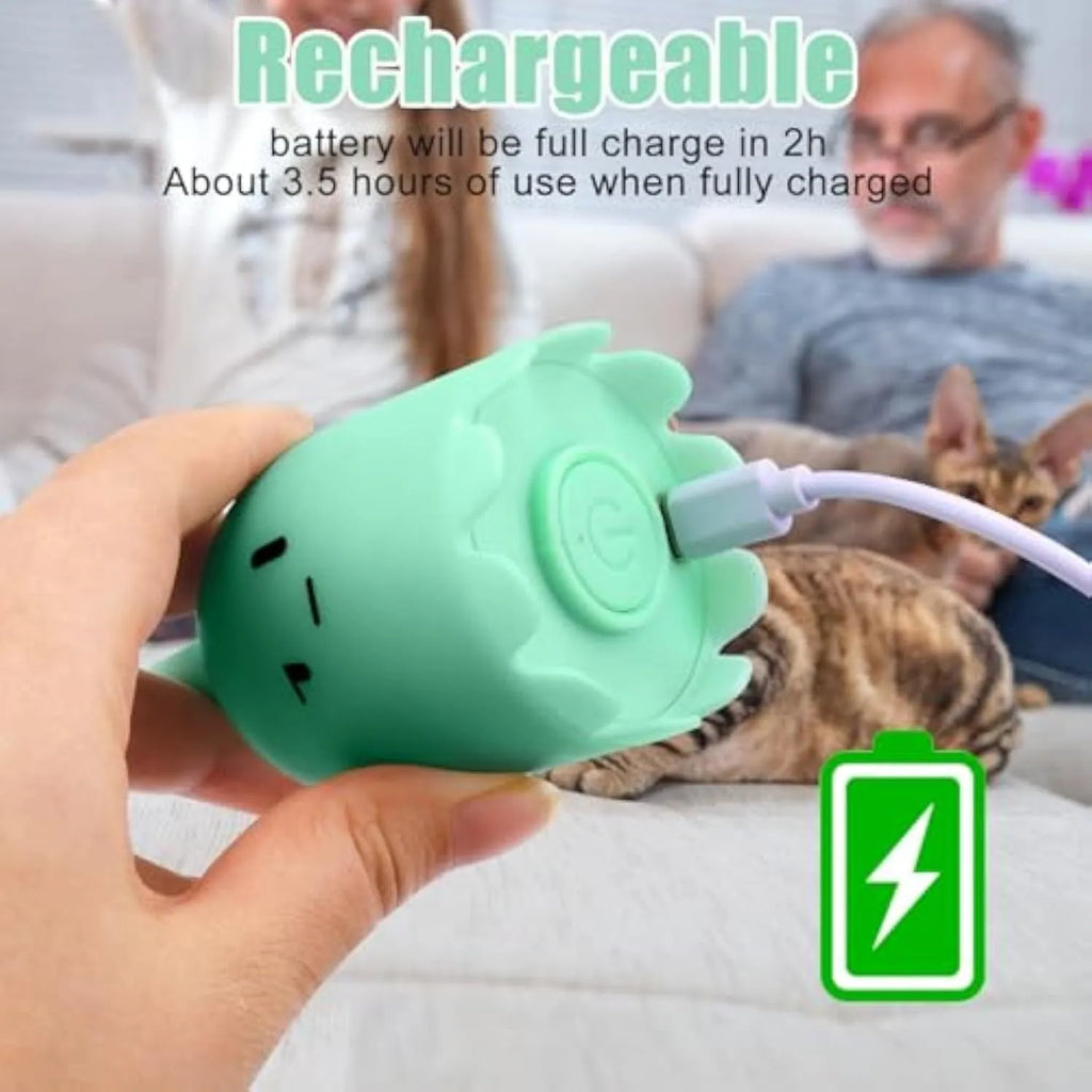Green automatic cat wand toy with swinging silicone tail on floor for indoor cat play