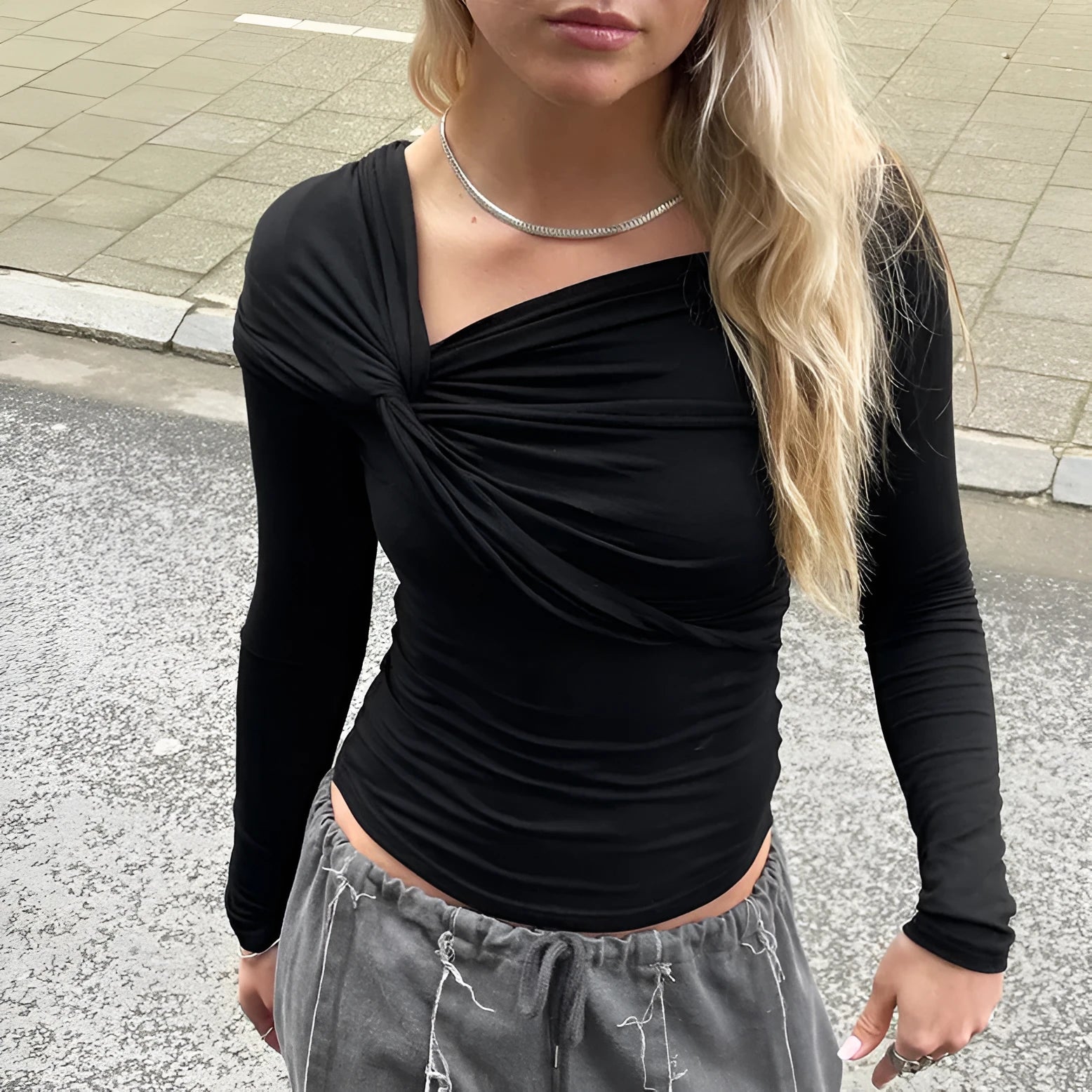 Black American Spicy Girl knot hem long sleeve top with stretch fabric, front view