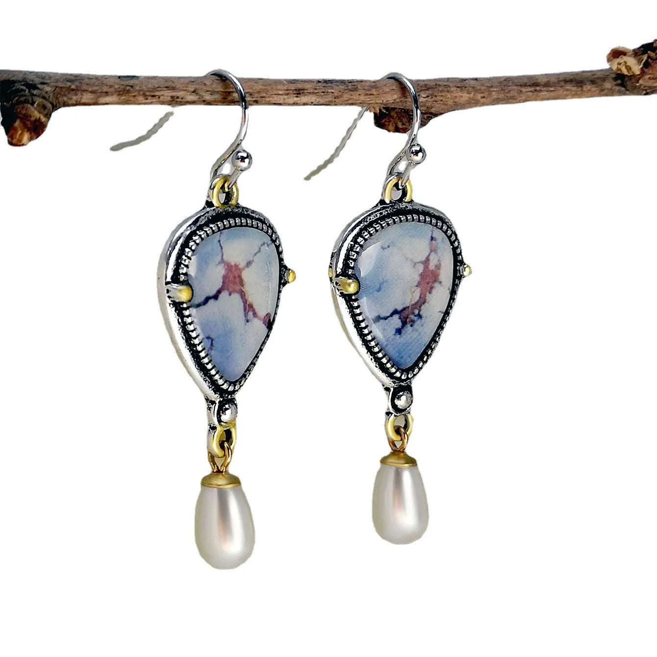 Retro blue women's drop earrings with geometric shape, synthetic opal and pearl details on electroplated metal.