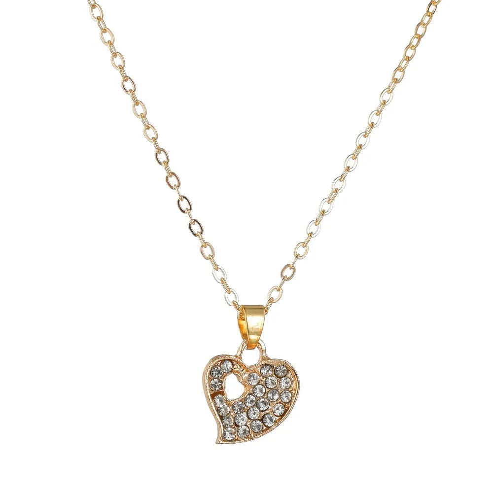 Gold colour women's jewellery set with earrings, pendant and adjustable bracelet featuring love, water drop and bell patterns