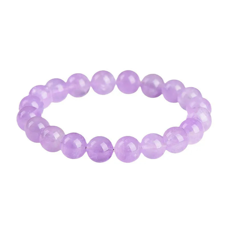 Light purple amethyst crystal bracelet with round beads and water ripple design on a wrist.