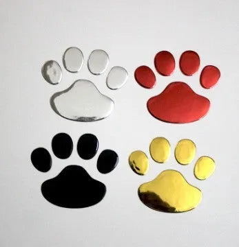 Pair of hand-shaped dog footprint car stickers in four colour options, each 7 cm long.