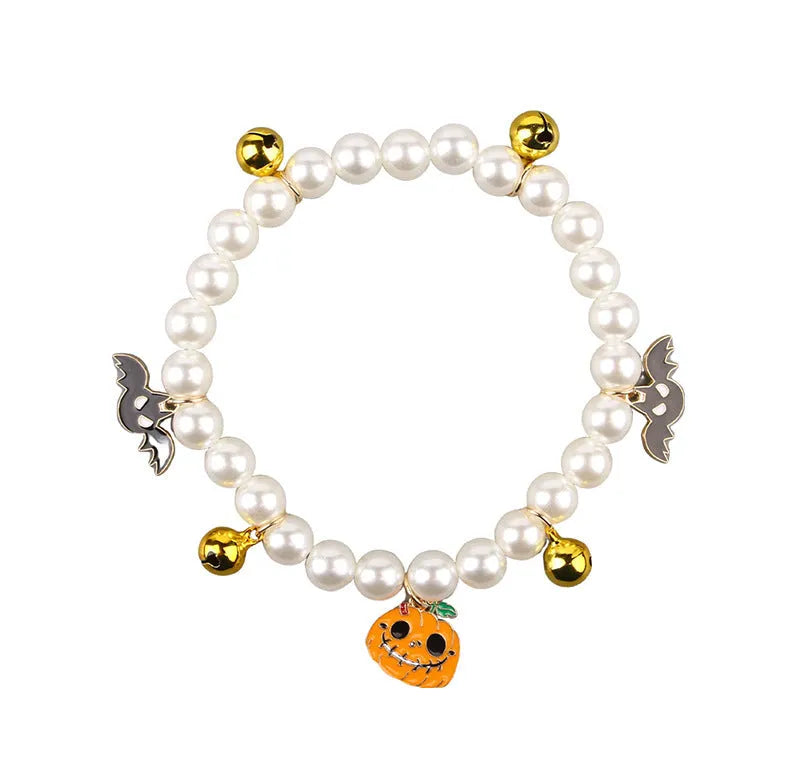 Halloween-themed cat collar with simulated pearl beading showing purple ghost pumpkin design.