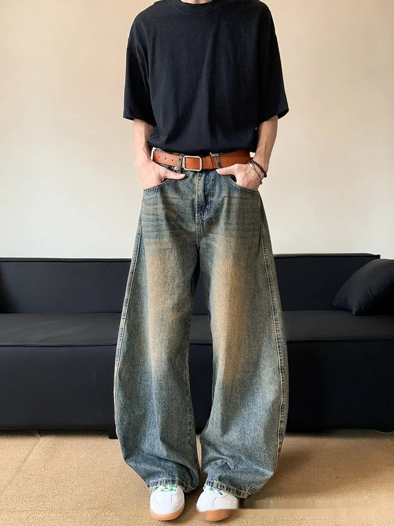 Men's retro blue distressed denim jeans with wide-leg cut and micro elasticity fabric