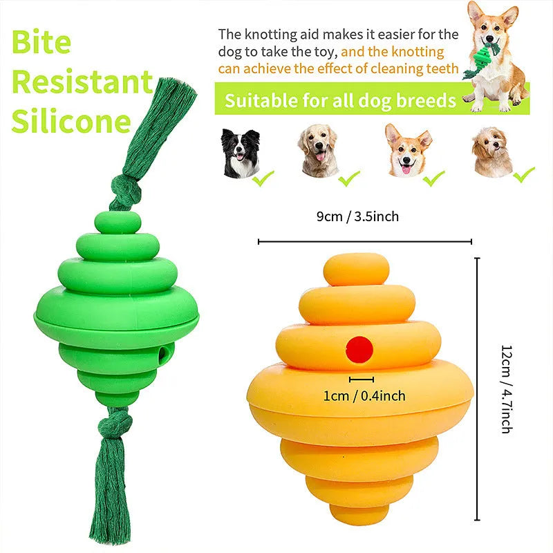 Green and yellow silicone dog ball with attached rope for tug-of-war and treat dispensing.
