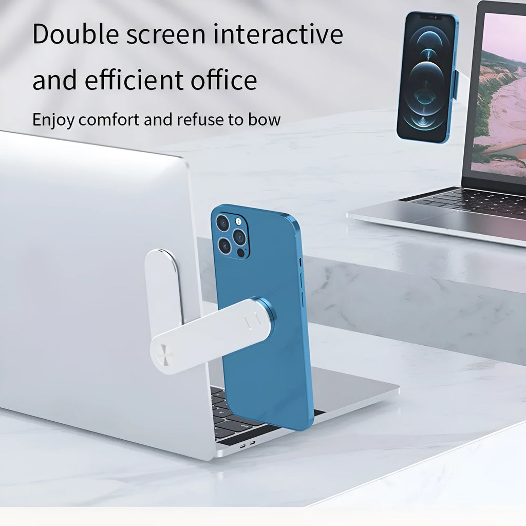 Black aluminium laptop phone holder with magnetic clip attached to a laptop screen, holding a smartphone.
