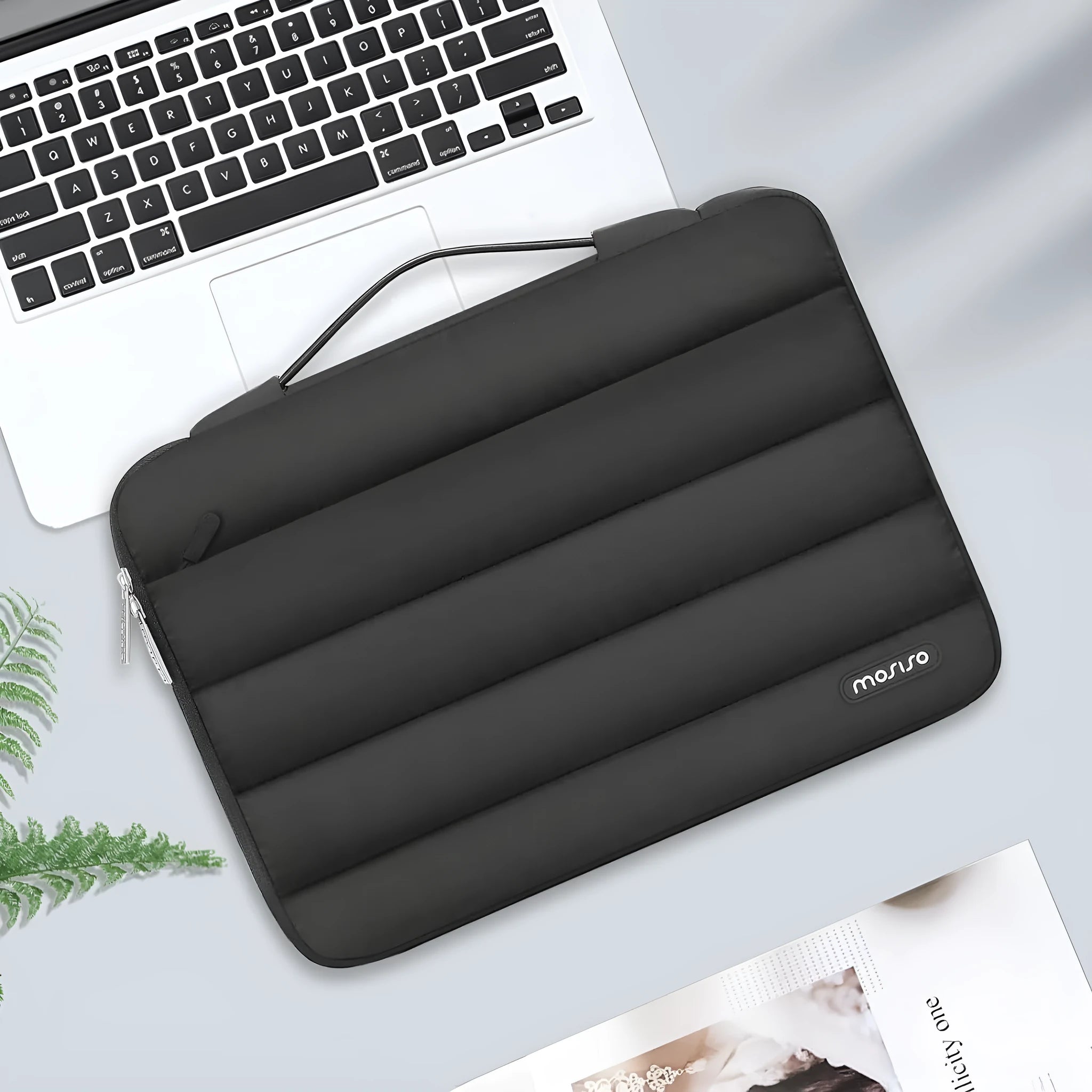 Black velvet laptop bag with plaid trim, shown next to a 15.4-inch laptop for scale.