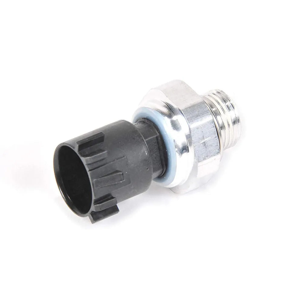 Silver automobile fuel pressure sensor with electrical connector isolated on white background.
