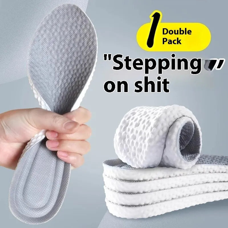 A pair of grey high-elasticity PU foam sports insoles on a white background, shown with scissors to illustrate the cut-to-fit design.