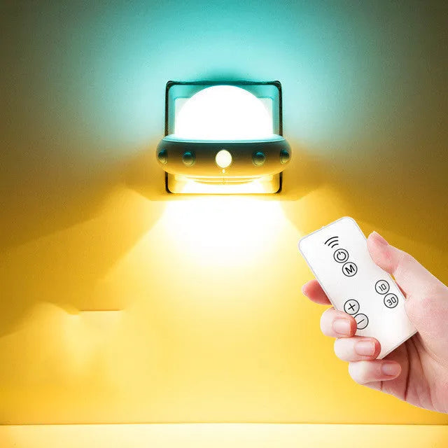 Remote control UFO-shaped bedside night light in blue, pink, or white with LED lighting