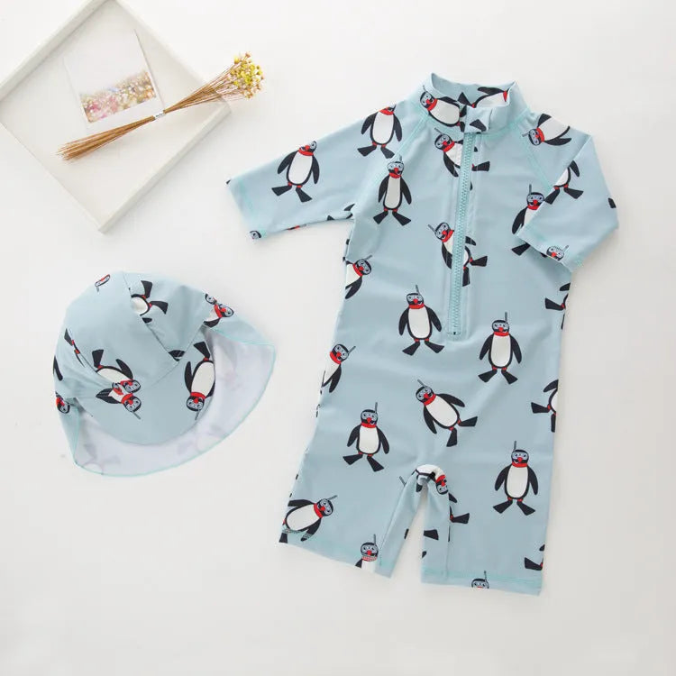 Boy's penguin themed long sleeve swimsuit with matching swimming cap for sun protection