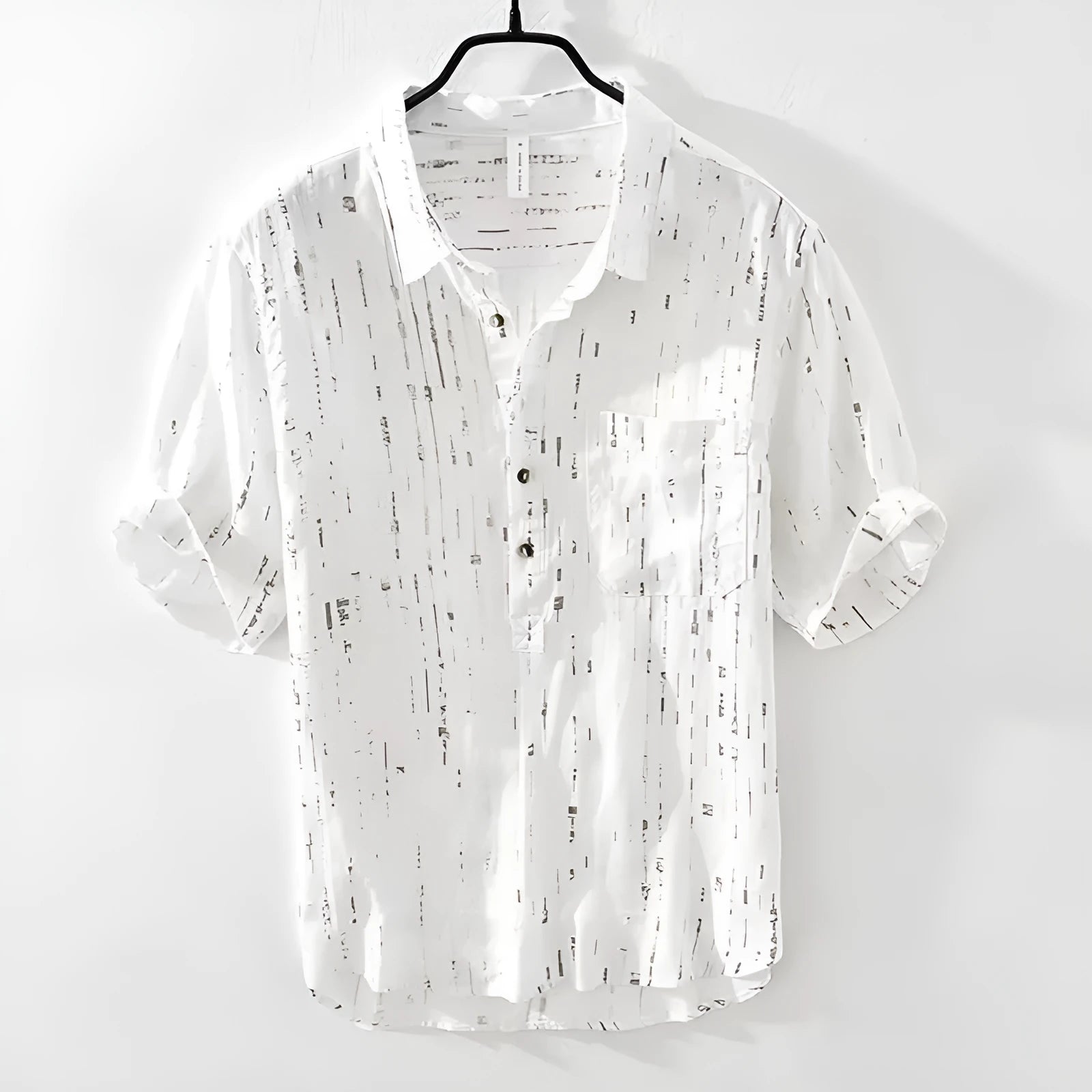 Men's loose fit short-sleeved polo shirt with lapel collar in black, laid flat.