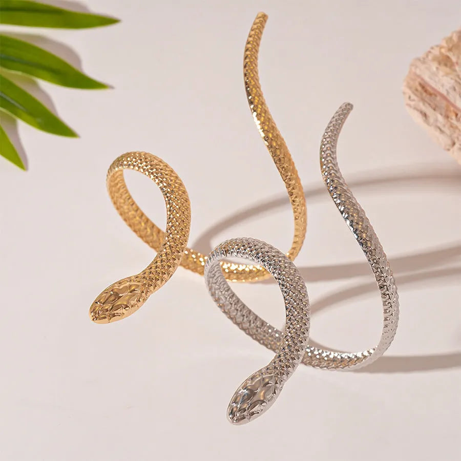 Snake-inspired ring and bracelet set with exaggerated twisted winding design in gold electroplated metal