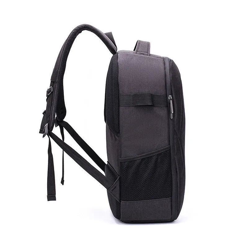 Black Oxford cloth drone backpack open to show internal camera, computer, and organiser pockets.