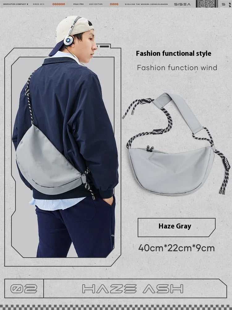 Men's large capacity commuter messenger bag in solid colour nylon with urban simplicity style