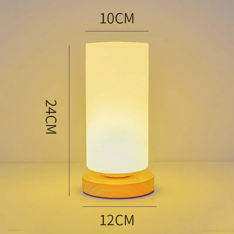 Nordic solid wood USB table lamp with touch dimming in white cube, cylinder, and ball styles on a wooden surface.