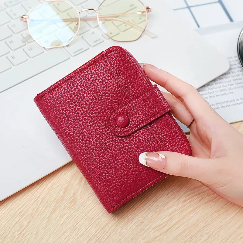 Ladies short fold wallet with lychee pattern in beige, pink, black, and red colours