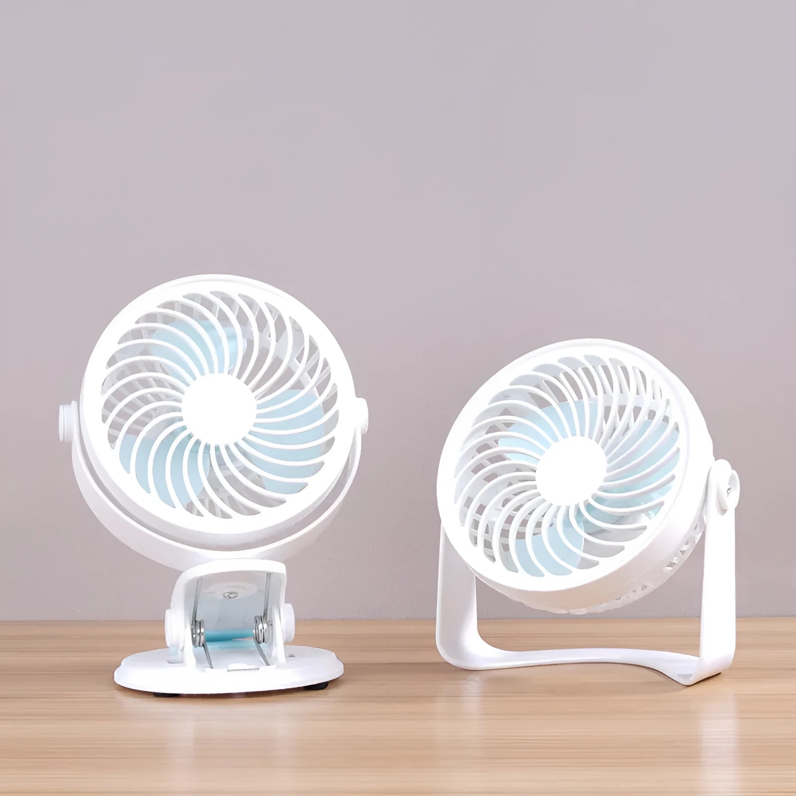 USB-powered mini clip fan with brushless motor and three blades on white desk